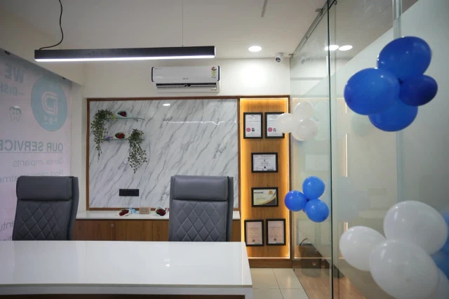 Real consultation desk and certificate display at Disharth Dentistry