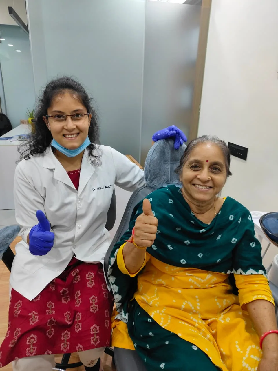Dr. Disha Barot with a senior patient at the clinic